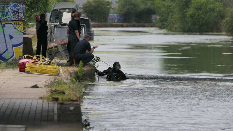Officers and police divers at the scene in North West London on the Grand Union Canal (Image: UkNewsinPictures)