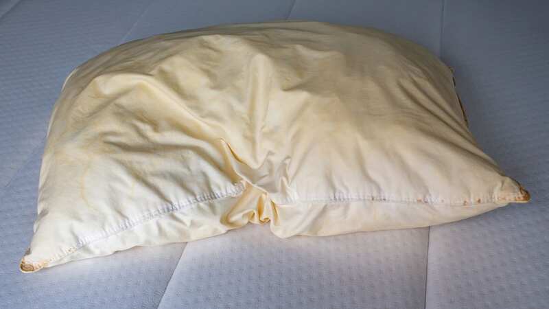 Pillows can become yellow due to sweating while you sleep (Image: Getty Images/iStockphoto)
