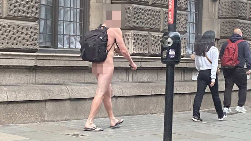 A nude commuter was spotted walking through London (Image: SWNS)