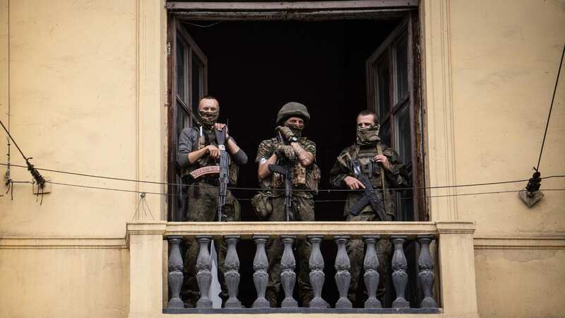 Members of the Wagner Company stand on the balcony of the circus building in Rostov-on-Don on June 24 (Image: AFP via Getty Images)