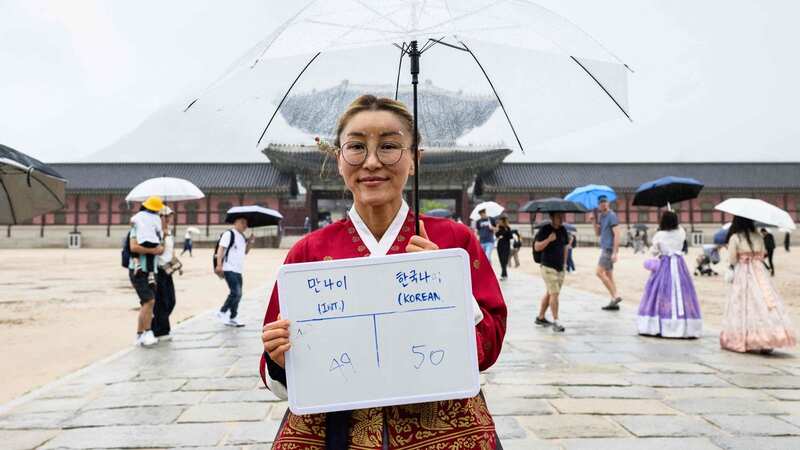 A woman in South Korea celebrates becoming "younger" (Image: AFP via Getty Images)