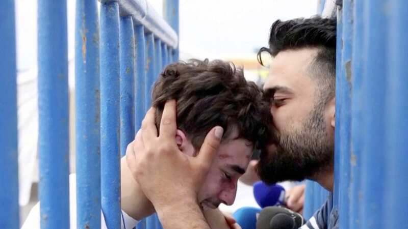 18-year-old man named Mohammad tearfully reunited with his brother after the shipwreck