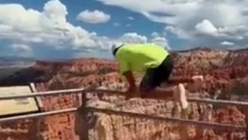 Horror moment man jumping canyon barrier stumbles and nearly plunges 800 feet
