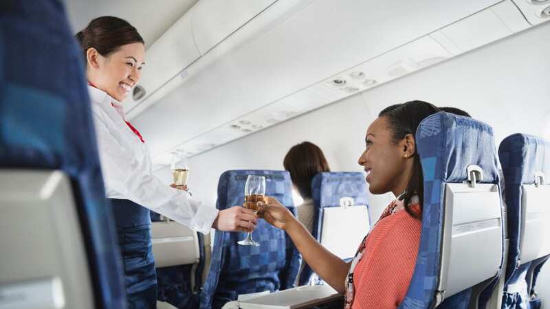 The effects of alcohol kick-in quicker and often stronger when flying (Image: Getty Images/Hero Images)