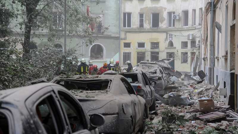 Four dead and people trapped under rubble after deadly Russian missile strike