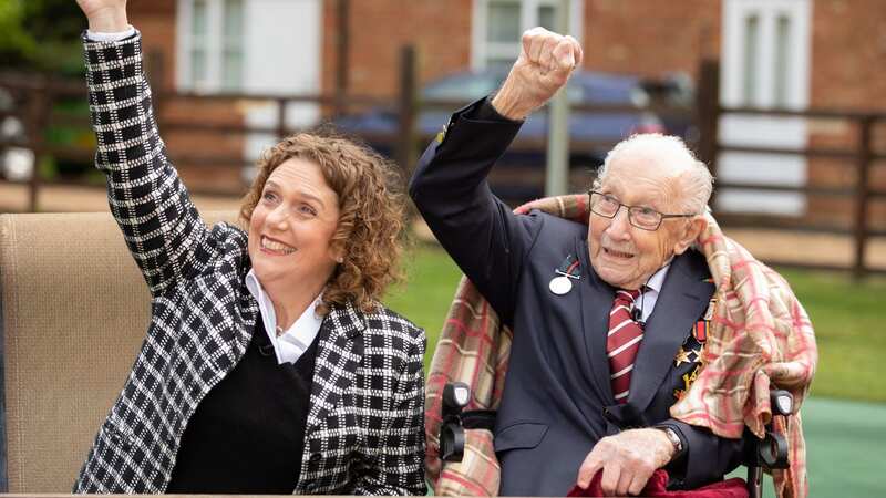 Hannah Ingram-Moore celebrates with her dad as Captain Tom Moore turned 100 in 2020 (Image: Getty Images)
