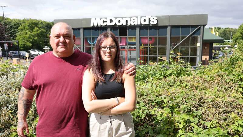 Holly with her dad Julian outside the branch (Image: Iain Buist/Newcastle Chronicle)