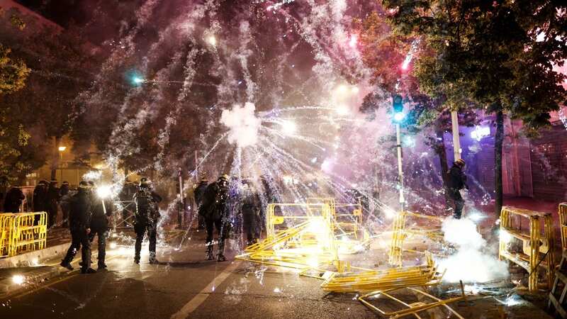 Protesters throw fireworks at riot police during clashes in Nanterre (Image: YOAN VALAT/EPA-EFE/REX/Shutterstock)