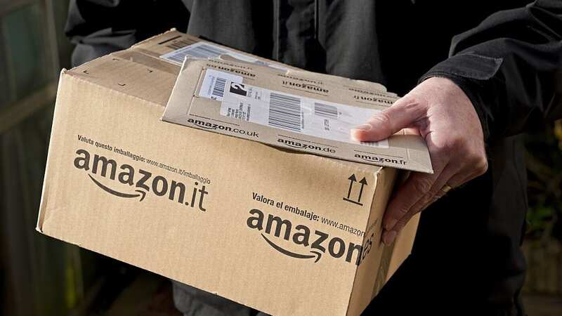 A man holding an Amazon delivery (Image: Universal Images Group via Getty Images)