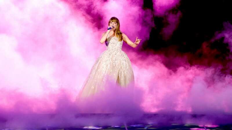 Taylor Swift performs onstage during "Taylor Swift | The Eras Tour", portraying the colours of 