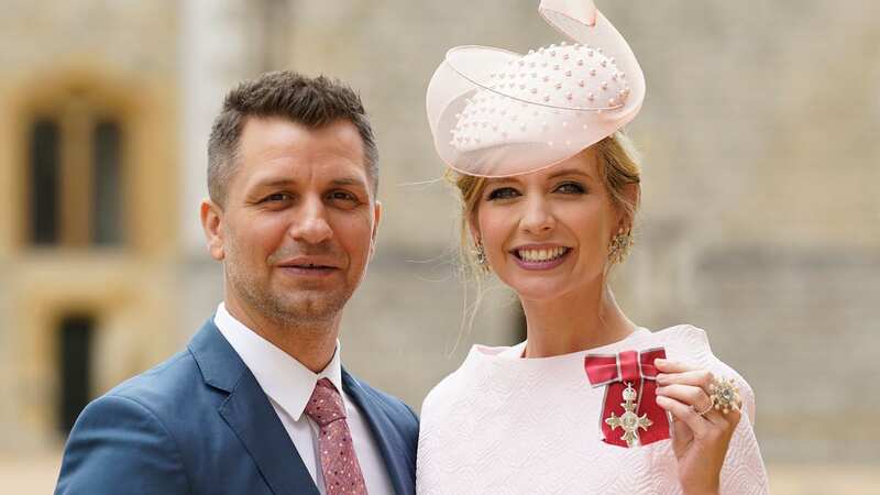 Rachel Riley supported by Pasha Kovalev as she accepts MBE from King Charles
