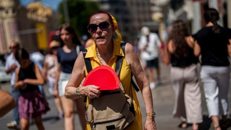 A woman fans herself in Madrid, Spain on Monday (Image: AP)