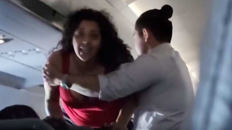 Two screaming women brawl in mid-air before they are hauled off diverted flight