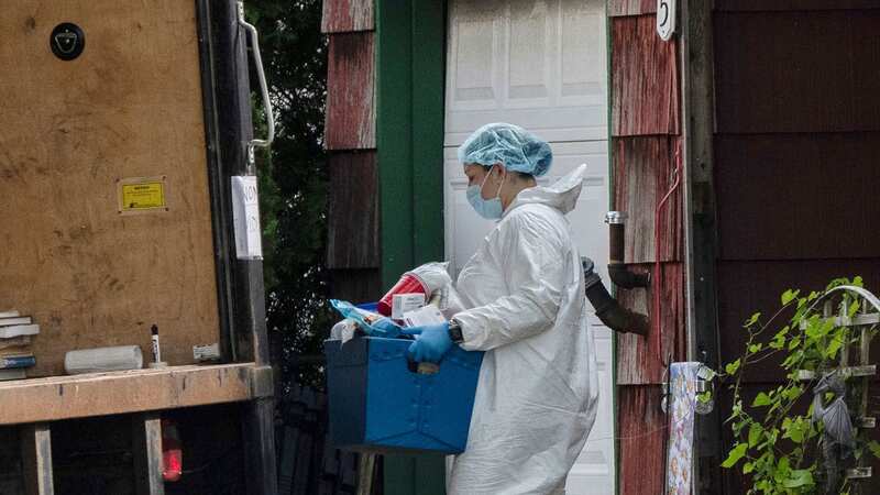 A crime laboratory officer removes a box of items as law enforcement searches the home of Rex Heuermann (Image: AP)