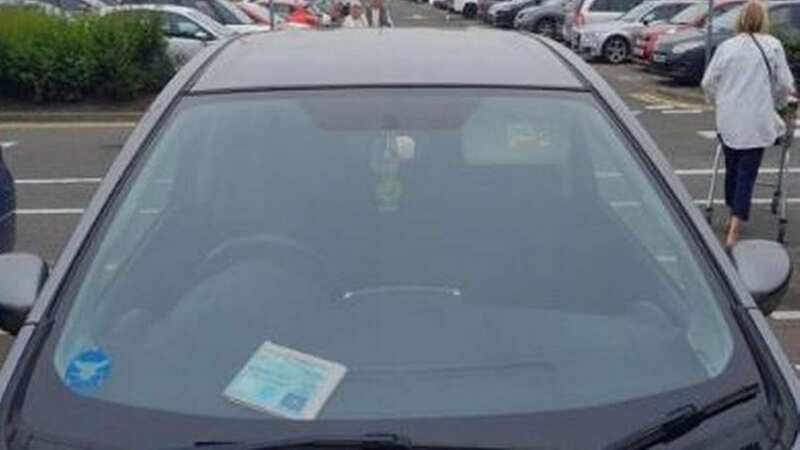 Louise Reilly was issued the badge in 2015, and placed it on the dashboard before going into the shop