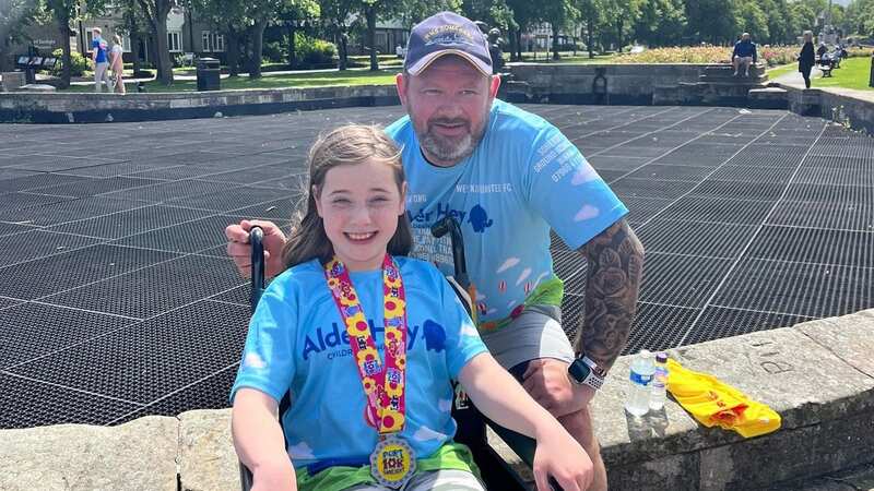 Grace pictured with stepdad Paul Brewin (Image: Elaine Brewin)