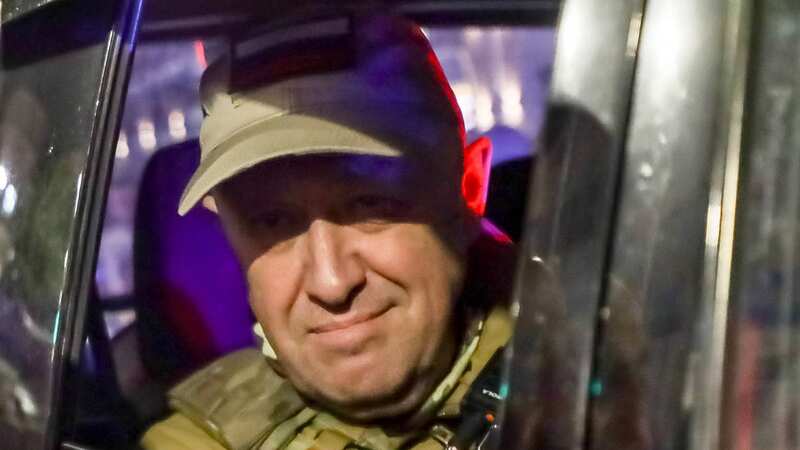 Yevgeny Prigozhin, the owner of the Wagner Group military company, looks from a military vehicle (Image: AP)