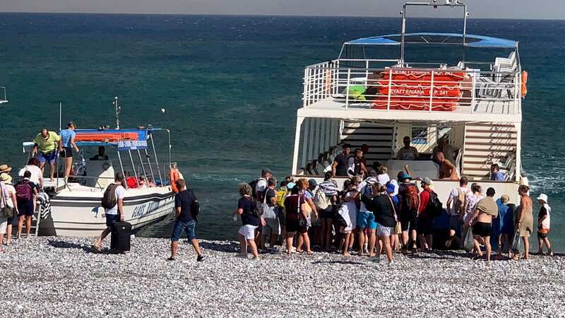 Rhodes wildfires sees holidaymakers stranded on beaches as fire rages behind