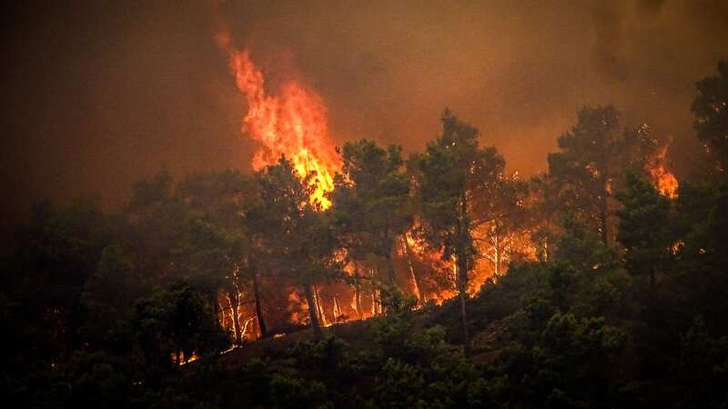 The terrifying blaze has torn across the popular holiday hotspot in Greece (Image: Eurokinissi/AFP via Getty Images)