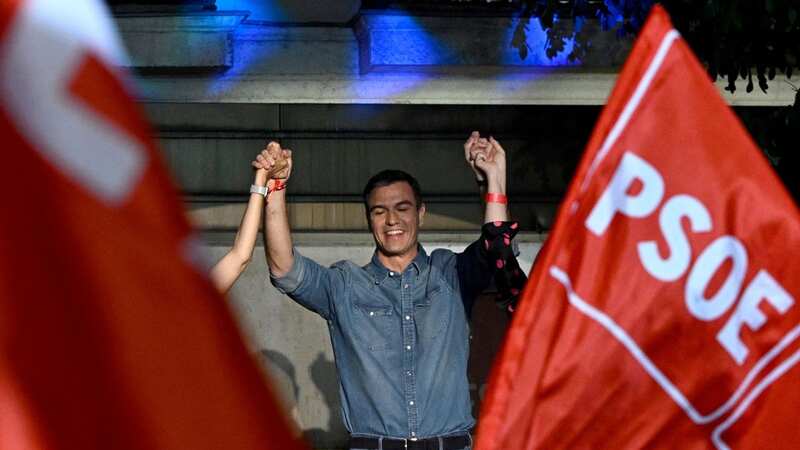 Spanish Prime Minister and Socialist Party (PSOE) candidate for re-election Pedro Sanchez and PSOE members celebrate (Image: AFP via Getty Images)