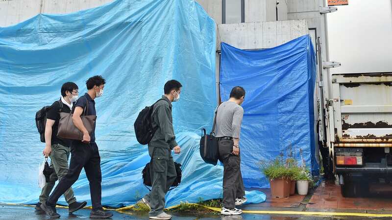 Police officers investigate the Tamura family house in Sapporo, Japan (Image: AP)