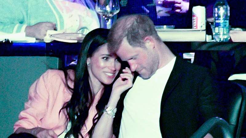 Prince Harry and Meghan Markle look relaxed at a basketball game between the Los Angeles Lakers and the Memphis Grizzlies (Image: Getty Images)