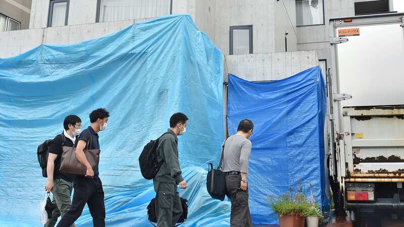 Police officers investigate the Tamura house in Sapporo (Image: AP)