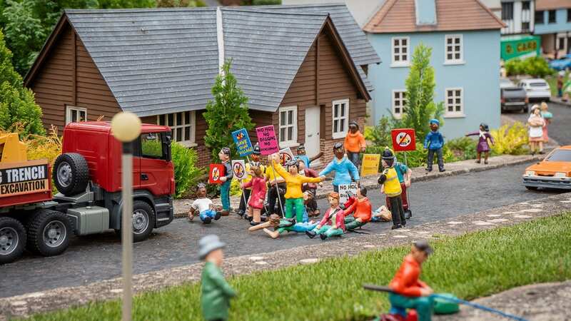 Models of protesters in the mini-village (Image: SWNS)