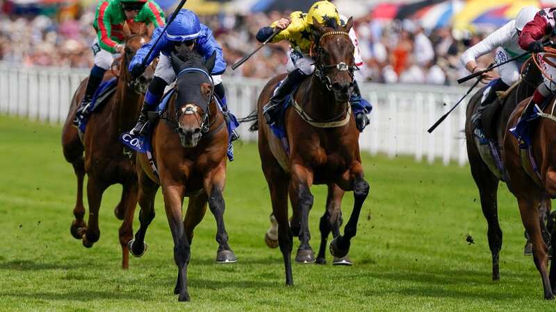 CHICHESTER, ENGLAND - JULY 30: Benoit de la Sayette riding Trawlerman (blue) win The Coral Summer Handicap during day five of the Qatar Goodwood Festival at Goodwood Racecourse on July 30, 2022 in Chichester, England. (Photo by Alan Crowhurst/Getty Images)