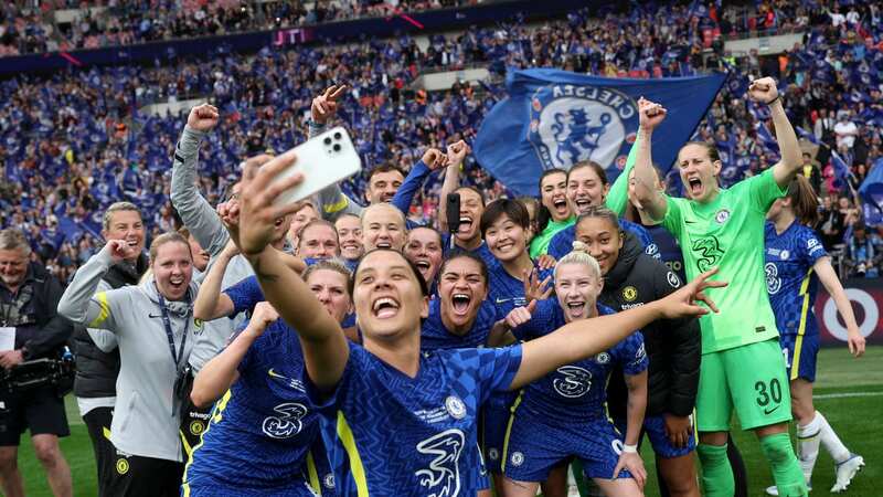 Sam Kerr of Chelsea takes a selfie as she celebrates with teammates following the Vitality Women