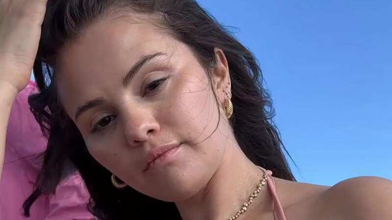 Selena Gomez has shown off her curves in a teeny pink bikini