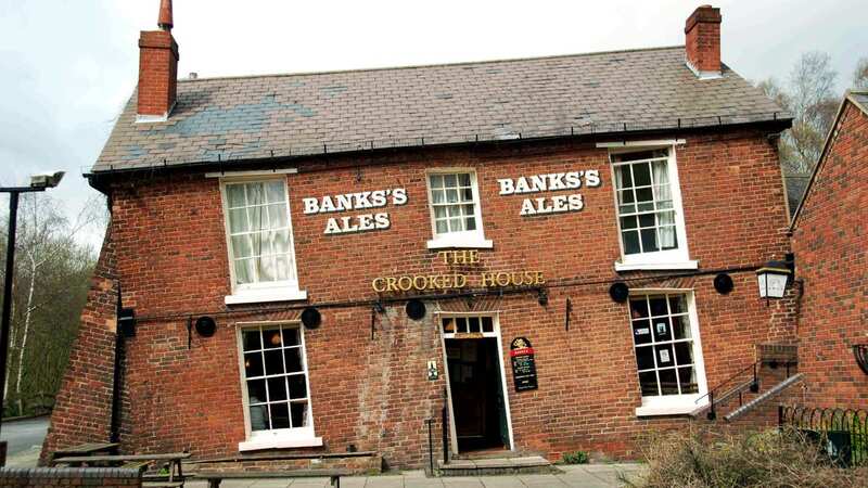 The Crooked House has long attracted visitors with one side 4ft lower than the other (Image: SWNS)