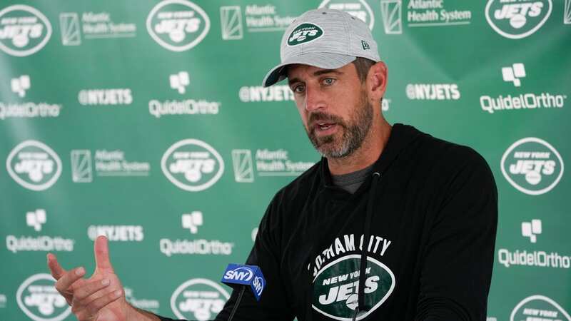 New York Jets quarterback Aaron Rodgers speaks to reporters after a practice.