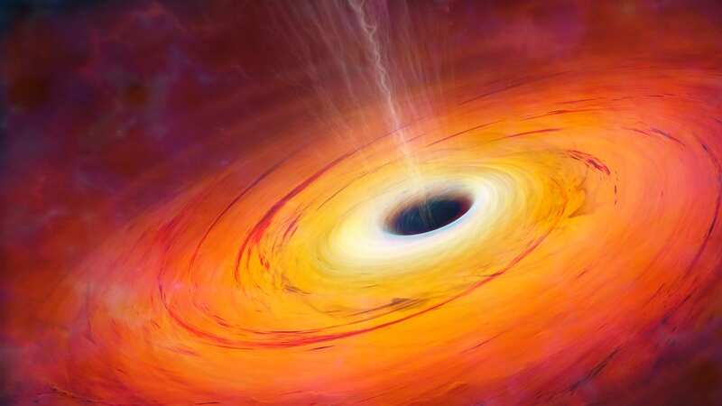 The black hole spits out a jet stream of particles and is surrounded by its accretion disk - matter it is slowly sucking inwards (stock image) (Image: Getty Images)