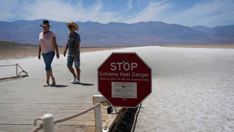 A sign warns visitors of extreme heat danger at Badwater Basin in Death Valley National Park (Image: AP)