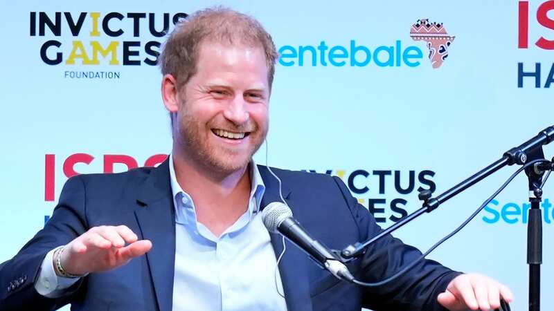 Prince Harry smiles as he speaks at the sport summit organised by ISPS (Image: AP)