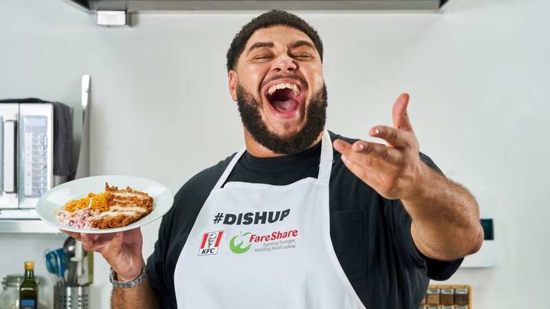 Big Zuu cooks up his favourite chicken dish using KFC, for people going hungry at West London FareShare community kitchen (Image: Simon Jacobs/PinPep)