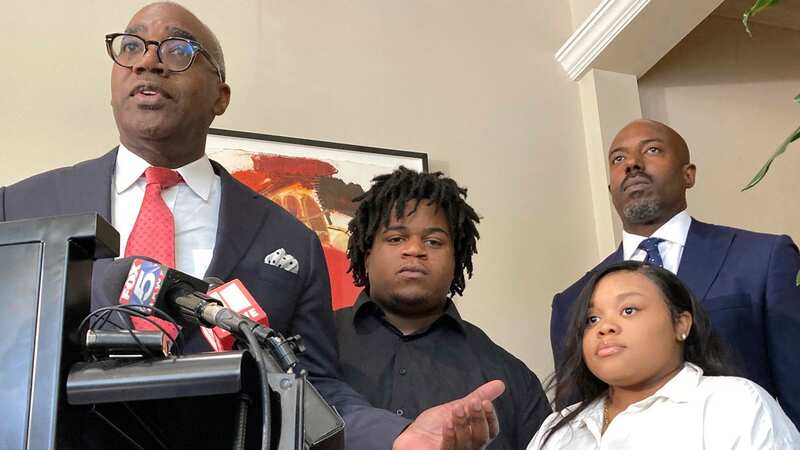 Attorney Roderick Edmond, from left, joined by Treveon Isaiah Taylor, Sr., Jessica Ross and attorney Cory Lynch. The couple are suing a doctor and Southern Regional Medical Center claiming a doctor too much force and decapitated Ross