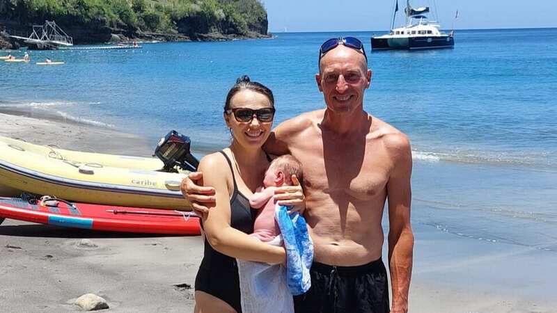 Iuliia Gurzhii poses with her husband Clive and their newborn baby Louisa (Image: Clive Gurzhii / SWNS)