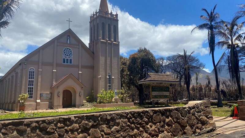 Maria Lanakila Catholic Church on Waine street is seen untouched in the aftermath of a wildfire in Lahaina (Image: AFP via Getty Images)