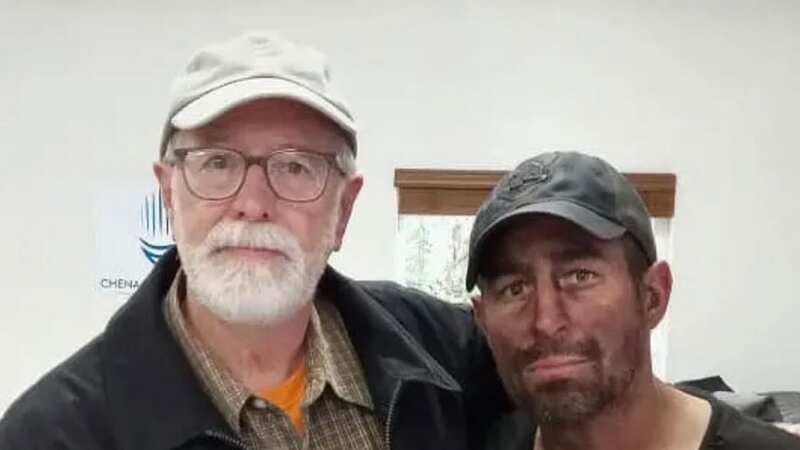 Missing Jonas Bare next to his dad after being found (Image: Missing in Alaska/Facebook)