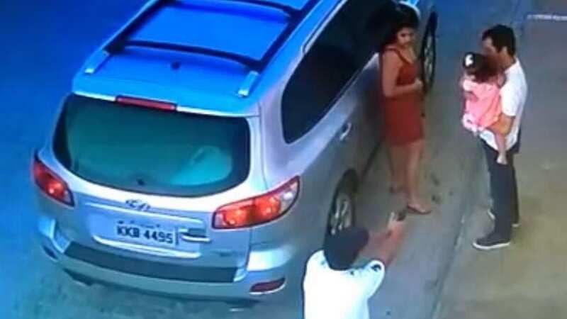 Dad about to be executed by hitman calmly handed baby daughter over to woman