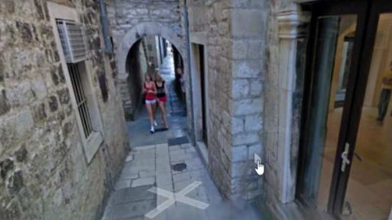 The user zoomed in after spotting two ladies walking near a building (Image: Google Street View)