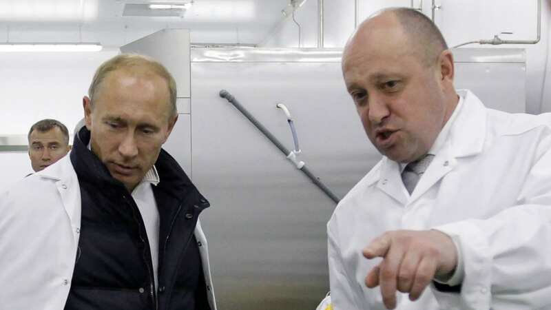 Yevgeny Prigozhin, right, with Vladimir Putin back in 2010 (Image: SPUTNIK/AFP via Getty Images)