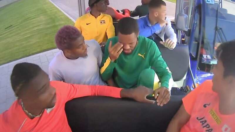 Hudson clutches his eye following collision. World champion Noah Lyles (red top) avoided injury (Image: BBC)