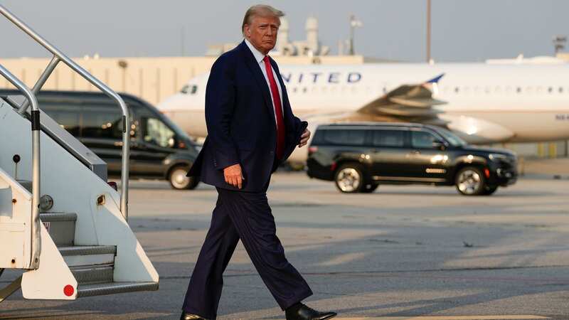 Trump deplanes from his private jet in Atlanta, Georgia, ahead of his historic fourth arrest (Image: AP)