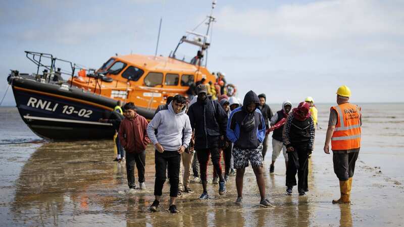 Migrants on beach in Kent (Image: TOLGA AKMEN/EPA-EFE/REX/Shutterstock)