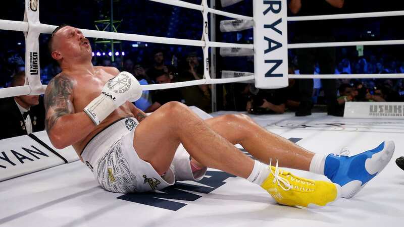 Oleksandr Usyk holds his groin in pain (Image: Getty Images)