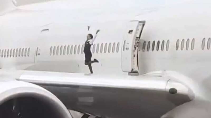 Cabin crew filmed dancing and posing for selfies on wing of Boeing 777