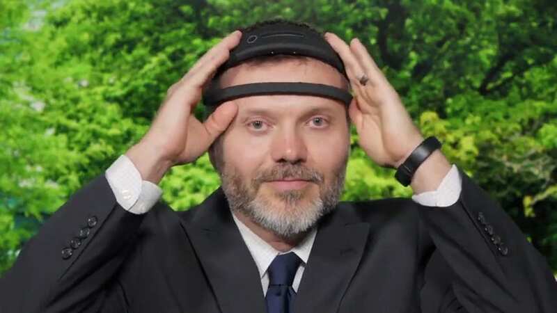 A volunteer shows off the headband (Image: SWNS)